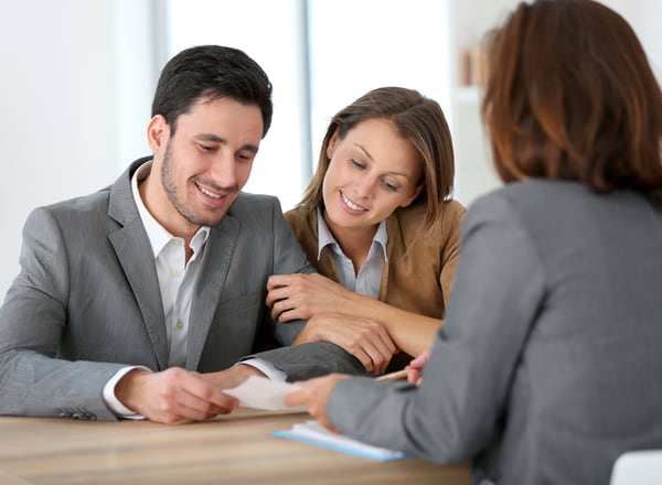 Couple meeting financial adviser for construction project