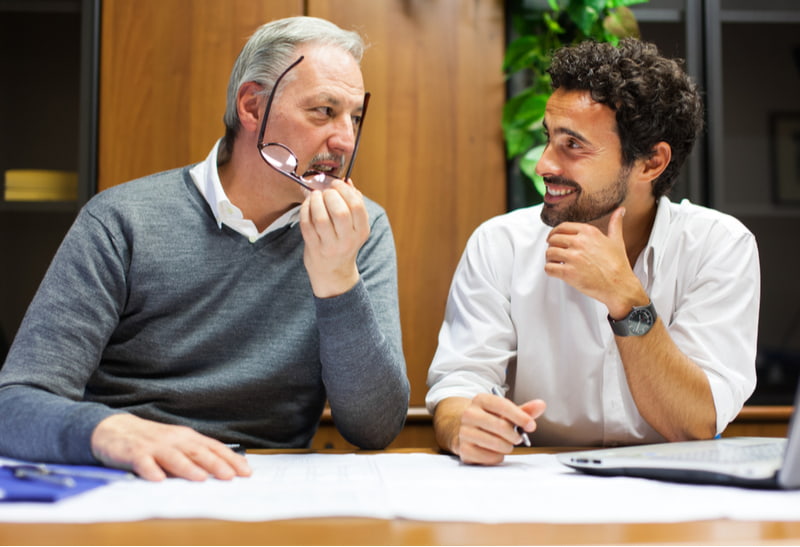 Two employees at work in an office